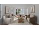 Bright living room featuring large windows, a neutral color palette, and a comfortable couch at 473 Silverleaf Ln, Dallas, GA 30157