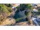 Aerial view of pond surrounded by trees and houses at 473 Silverleaf Ln, Dallas, GA 30157