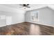 Spacious bedroom with hardwood floors and ceiling fan at 1685 Bullard Rd, Powder Springs, GA 30127