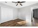 Bright bedroom with hardwood floors and double door closet at 1685 Bullard Rd, Powder Springs, GA 30127