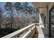 Outdoor balcony view with lush, green trees and foliage at 25213 Plantation Ne Dr # 25213, Atlanta, GA 30324