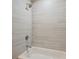 Modern bathroom features a tub with updated tile surround at 25213 Plantation Ne Dr # 25213, Atlanta, GA 30324