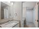 Bathroom featuring a granite counter top and tiled shower with dual closets at 25213 Plantation Ne Dr # 25213, Atlanta, GA 30324