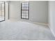 Bright bedroom featuring a window and closet with light gray walls and carpet at 25213 Plantation Ne Dr # 25213, Atlanta, GA 30324