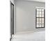 Bright bedroom featuring a window and closet with light gray walls and light carpet at 25213 Plantation Ne Dr # 25213, Atlanta, GA 30324