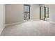 Spacious bedroom with large window and mirrored closet doors at 25213 Plantation Ne Dr # 25213, Atlanta, GA 30324