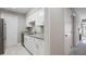 Updated kitchen featuring white cabinets, granite countertops, and stainless steel dishwasher at 25213 Plantation Ne Dr # 25213, Atlanta, GA 30324