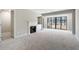 Spacious living room featuring a fireplace and balcony access at 25213 Plantation Ne Dr # 25213, Atlanta, GA 30324