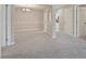 Bright living room showcasing fresh paint, neutral carpet and multiple doorways at 25213 Plantation Ne Dr # 25213, Atlanta, GA 30324