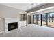 Bright living room featuring a fireplace and access to a balcony at 25213 Plantation Ne Dr # 25213, Atlanta, GA 30324