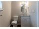 A view of bathroom with granite vanity, modern fixtures, and a clean design at 1137 2Nd Nw St, Atlanta, GA 30318