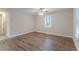 Bright bedroom featuring hardwood floors, ceiling fan, and a window at 1137 2Nd Nw St, Atlanta, GA 30318