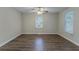 Bright bedroom featuring hardwood floors, ceiling fan, and a window at 1137 2Nd Nw St, Atlanta, GA 30318