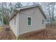 A side view of the home showing the exterior, siding, and windows at 1137 2Nd Nw St, Atlanta, GA 30318