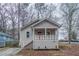 Charming single Gathering home featuring a cozy front porch and a well-maintained yard at 1137 2Nd Nw St, Atlanta, GA 30318
