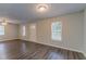 Bright living room with hardwood floors, neutral paint, and natural light from several windows at 1137 2Nd Nw St, Atlanta, GA 30318