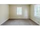 Neutral bedroom with plush carpeting and bright window at 2096 Snow Sw Rd, Atlanta, GA 30311