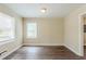 Bedroom with laminate floors and a double window at 2096 Snow Sw Rd, Atlanta, GA 30311