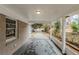 View of the carport and driveway with a brick wall and view of the front yard at 2096 Snow Sw Rd, Atlanta, GA 30311
