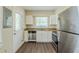 Kitchen featuring stainless steel appliances, white cabinets, and dark laminate floors at 2096 Snow Sw Rd, Atlanta, GA 30311