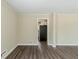 Spacious living room with laminate floors that transition to the kitchen area at 2096 Snow Sw Rd, Atlanta, GA 30311
