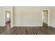 Spacious living room with new laminate floors and neutral-colored walls at 2096 Snow Sw Rd, Atlanta, GA 30311