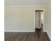 An empty living room featuring laminate floors and neutral walls at 2096 Snow Sw Rd, Atlanta, GA 30311
