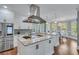 Modern kitchen featuring stainless steel appliances, granite countertops, and light-filled breakfast nook at 2475 Gants Hill Pl, Cumming, GA 30041