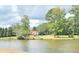 House on a lake with large green yard at 300 Jonesboro Rd, Mcdonough, GA 30253