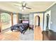 Spacious bedroom with arched windows, tile floors, and ample natural light at 300 Jonesboro Rd, Mcdonough, GA 30253