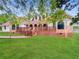 House exterior with a red roof, brick accents, and a well-manicured lawn at 300 Jonesboro Rd, Mcdonough, GA 30253