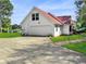 Detached garage with a large door and brick pathway at 300 Jonesboro Rd, Mcdonough, GA 30253