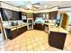 Kitchen with granite countertops and dark wood cabinets at 300 Jonesboro Rd, Mcdonough, GA 30253