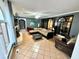 Spacious living room with a cozy fireplace and tile floors at 300 Jonesboro Rd, Mcdonough, GA 30253