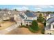 Aerial view of a suburban home showcasing its roof, landscaping, and proximity to neighboring houses at 4335 Silent Path, Cumming, GA 30028