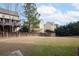 Large, grassy backyard with a wooden fence and mature trees at 4335 Silent Path, Cumming, GA 30028