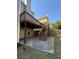 Spacious backyard featuring a wooden deck, stairs, and a concrete patio, perfect for outdoor living at 4335 Silent Path, Cumming, GA 30028
