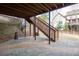 Ground-level patio with wooden stairs leading to the backyard at 4335 Silent Path, Cumming, GA 30028