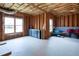 Unfinished basement featuring exposed framing, dual windows and ample storage space at 4335 Silent Path, Cumming, GA 30028