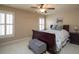 Bedroom featuring shuttered windows, neutral paint and a dark wood bed at 4335 Silent Path, Cumming, GA 30028