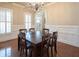 Bright dining room featuring hardwood floors, coffered ceilings and white plantation shutters at 4335 Silent Path, Cumming, GA 30028