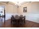 Traditional dining room featuring hardwood floors, wainscoting and coffered ceilings at 4335 Silent Path, Cumming, GA 30028