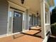 Covered front porch with white columns and gray exterior at 4335 Silent Path, Cumming, GA 30028