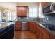 Spacious kitchen featuring stainless steel appliances, island and granite countertops at 4335 Silent Path, Cumming, GA 30028