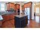 Open concept kitchen features a large island and stainless steel appliances at 4335 Silent Path, Cumming, GA 30028