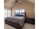 Serene main bedroom with large bed, side table, and shuttered windows, offering peaceful retreat at 4335 Silent Path, Cumming, GA 30028