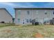 Backyard with lawn and the back of the home at 5831 Taka Ln, Lithonia, GA 30038