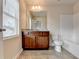 Bright bathroom with a granite vanity and a full bathtub at 5831 Taka Ln, Lithonia, GA 30038