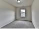 Cozy bedroom with gray carpet and a bright window view at 5831 Taka Ln, Lithonia, GA 30038