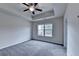 Bedroom with a tray ceiling and a ceiling fan at 5831 Taka Ln, Lithonia, GA 30038